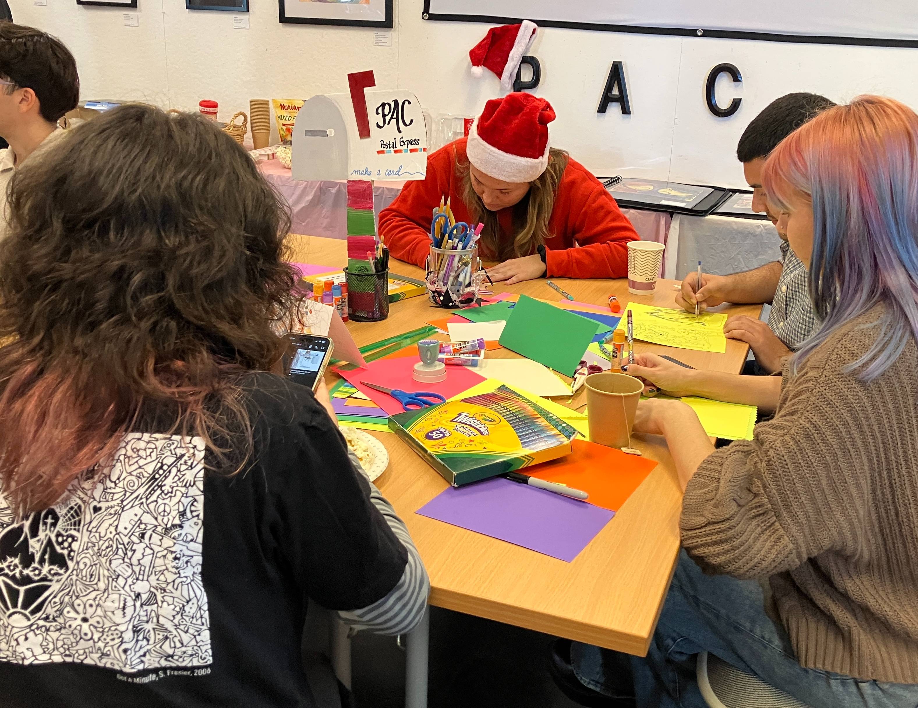 IAHSJ team make holiday cards at holiday party