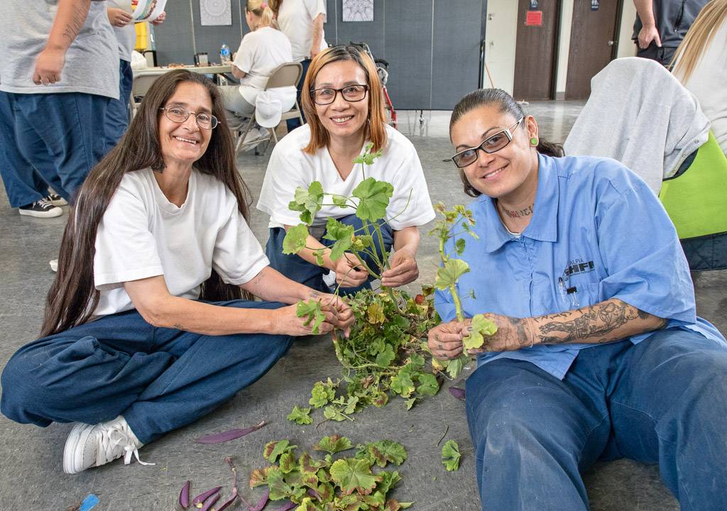 Women from California Institution for Women gather organic material as part of a mandala art project for Prison Arts Collective. Photo courtesy of Peter Merts, 2016.