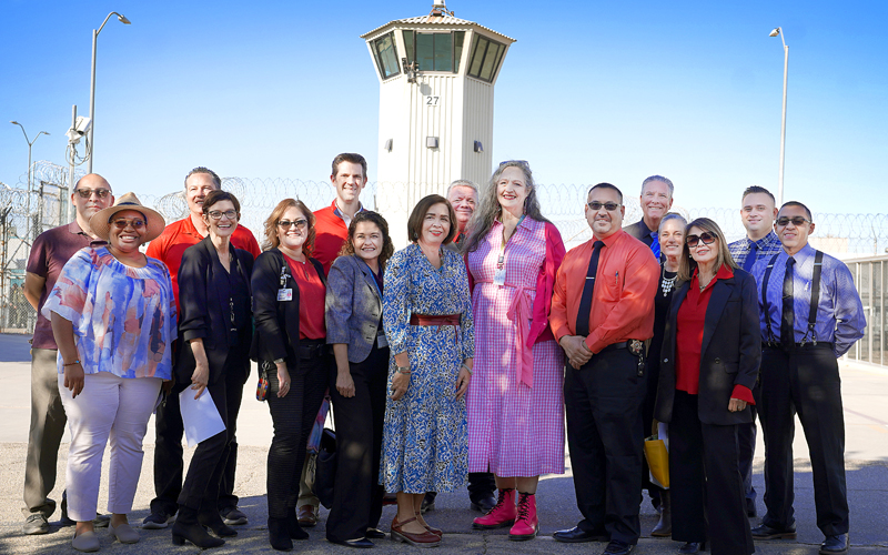 SDSU President Adela de la Torre and Superintendent of the CDCR Office Correctional Education Shannon Swain (center) visit the VISTA program alongside leadership from SDSU, CDCR, and Centinela State Prison. 